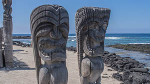 These Tiki are part of Hikiau Heiau, a traditional religious site within the Kealakekua Bay State Historical Park. The park was the site of the first extensive contact between Hawaiians and Westerners with the arrival of Captain Cook in 1779. It has a cultural center, historical reconstructions and nearby swimming and snorkeling.